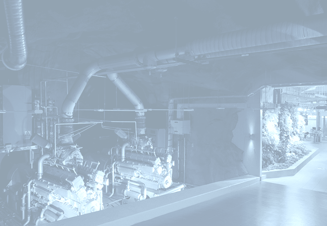 Maybach U-boat submarine diesel generators inside Pionen White Mountain data center engine room. German WWII-era Maybach diesel engines repurposed as backup power systems for the nuclear-hardened bunker facility in Stockholm, Sweden.